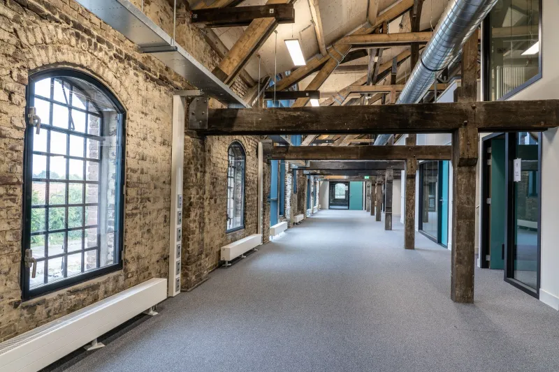 Converted to a Lesser Purpose: Why Residential Transformation Is Costing Mill Buildings Their Greatest Economic Potential